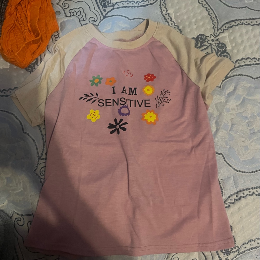 light pink with “i am sensitive” on it